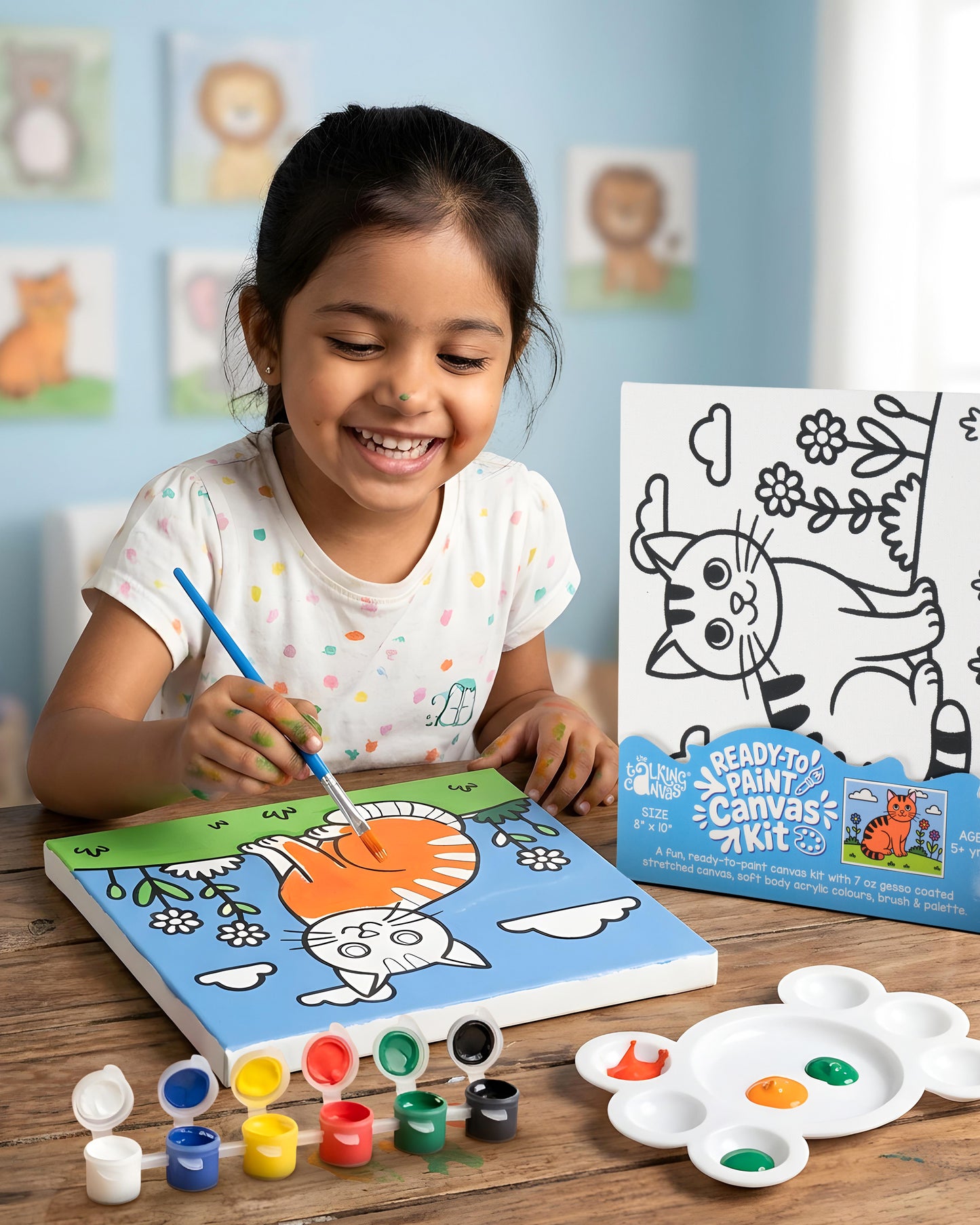 Child painting the Capybara Ready-to-Paint Canvas Kit 8×10 using acrylic paints to create a colourful capybara artwork with flowers and sky.