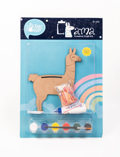 Front of The Talking Canvas Llama Creative Craft Kit with MDF llama cutout, yarn, glue, brush and 6 acrylic paint pots in blue packaging.