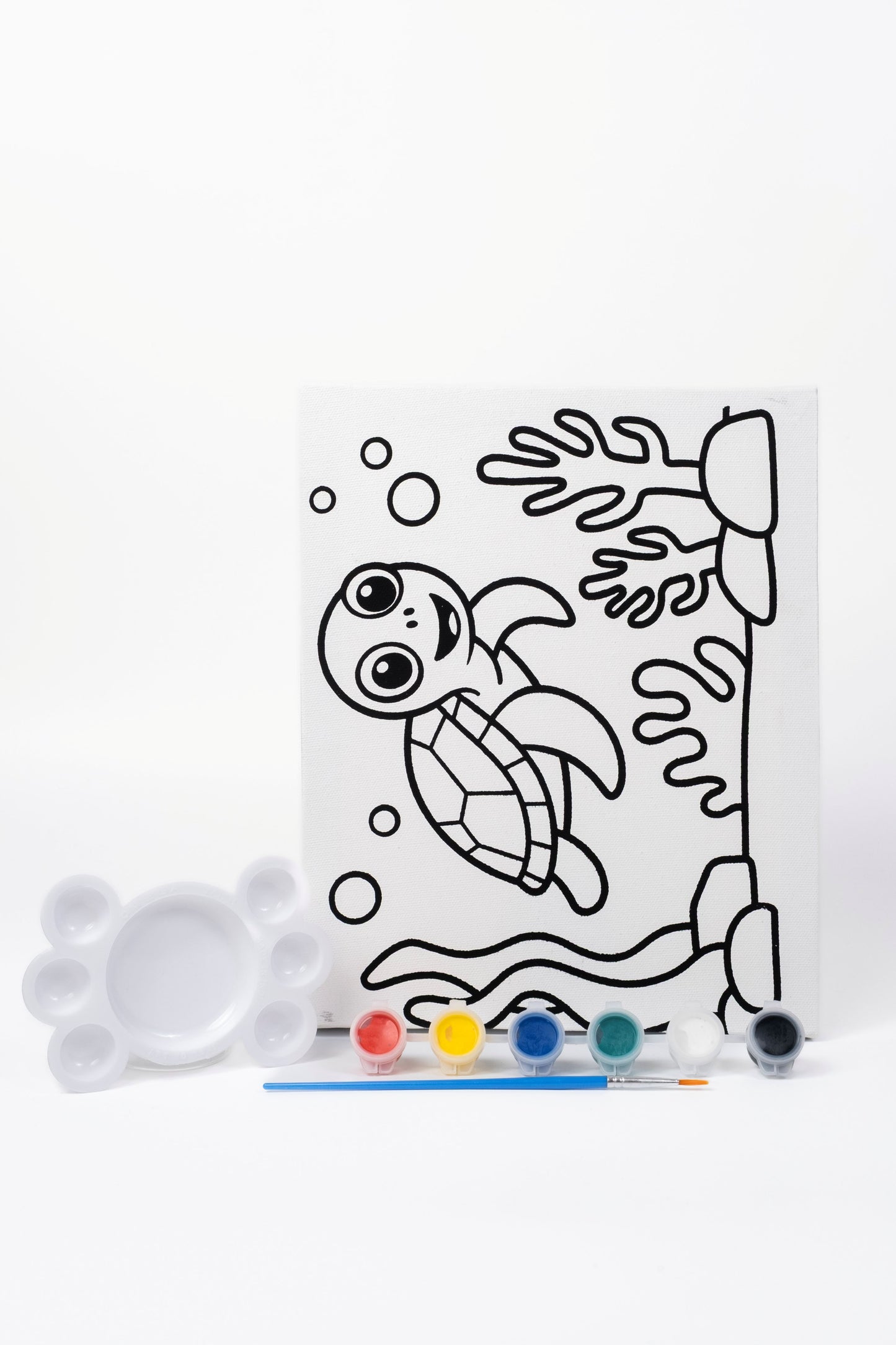 Ready-to-Paint Canvas Kit – Tortoise 8×10 with pre-printed canvas, acrylic paints, paint brush and paint palette on display.
