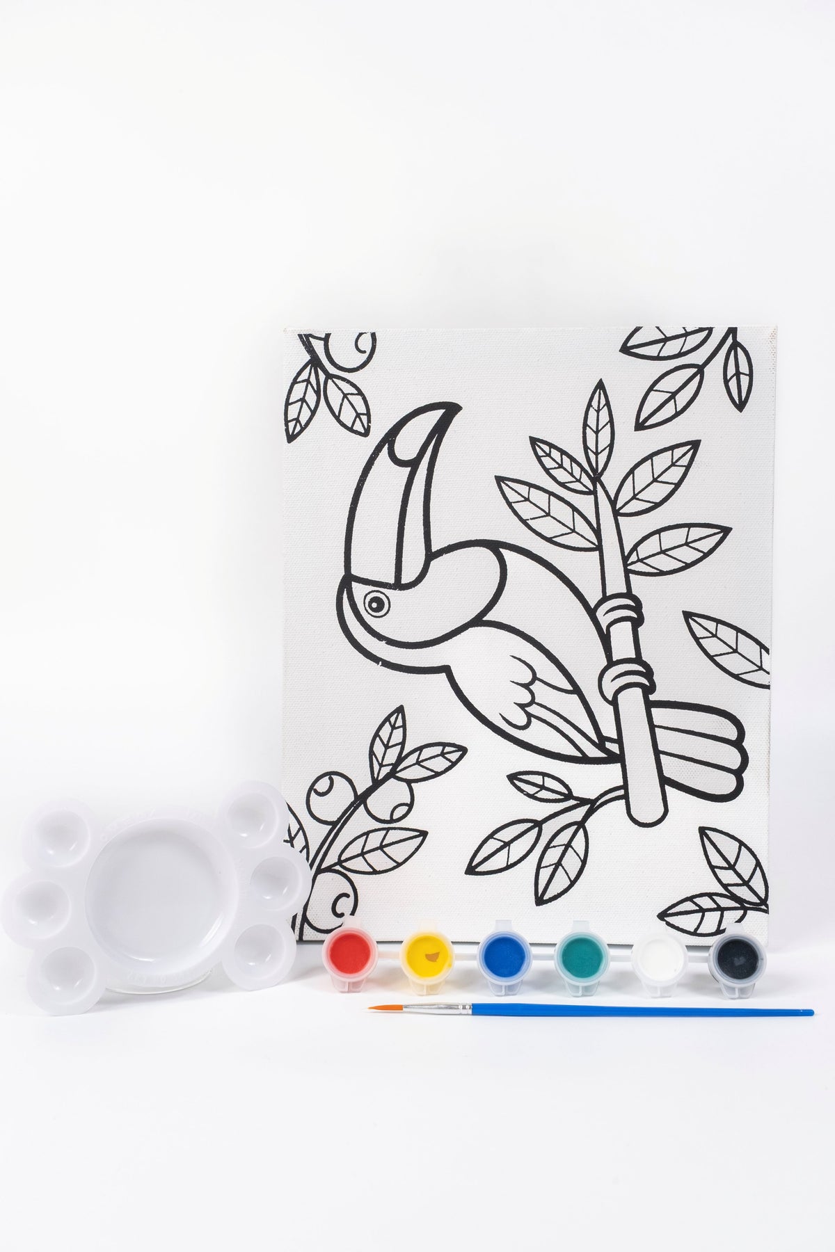 Parrot Ready-to-Paint Canvas Kit 8×10 with pre-printed parrot canvas, acrylic paint pots, paint brush and palette on white background.