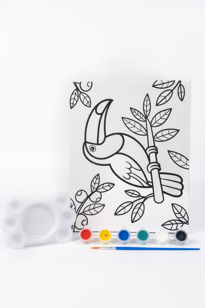 Parrot Ready-to-Paint Canvas Kit 8×10 with pre-printed parrot canvas, acrylic paint pots, paint brush and palette on white background.