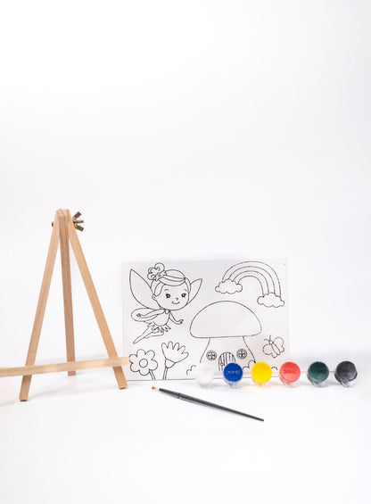 Fairy Canvas Painting Kit contents featuring a pre-printed fairy canvas, wooden easel, six acrylic paint pots and paint brush on a white background.