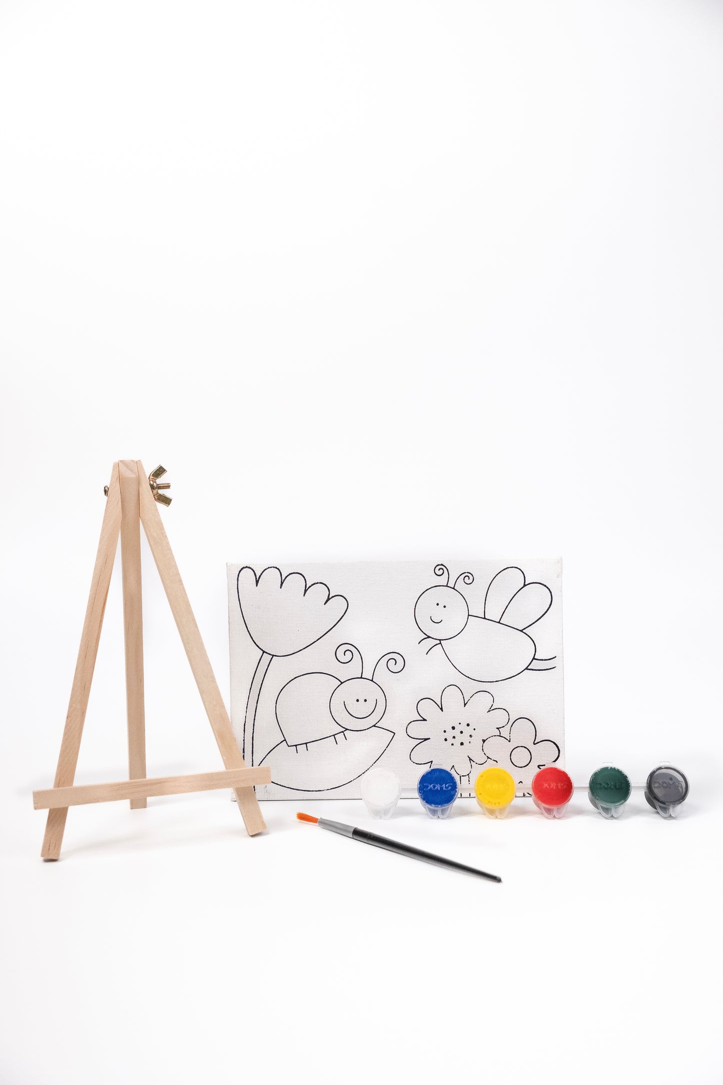 Contents of The Talking Canvas Garden Canvas Painting Kit including pre-printed garden canvas, wooden easel stand, paints and paint brush.