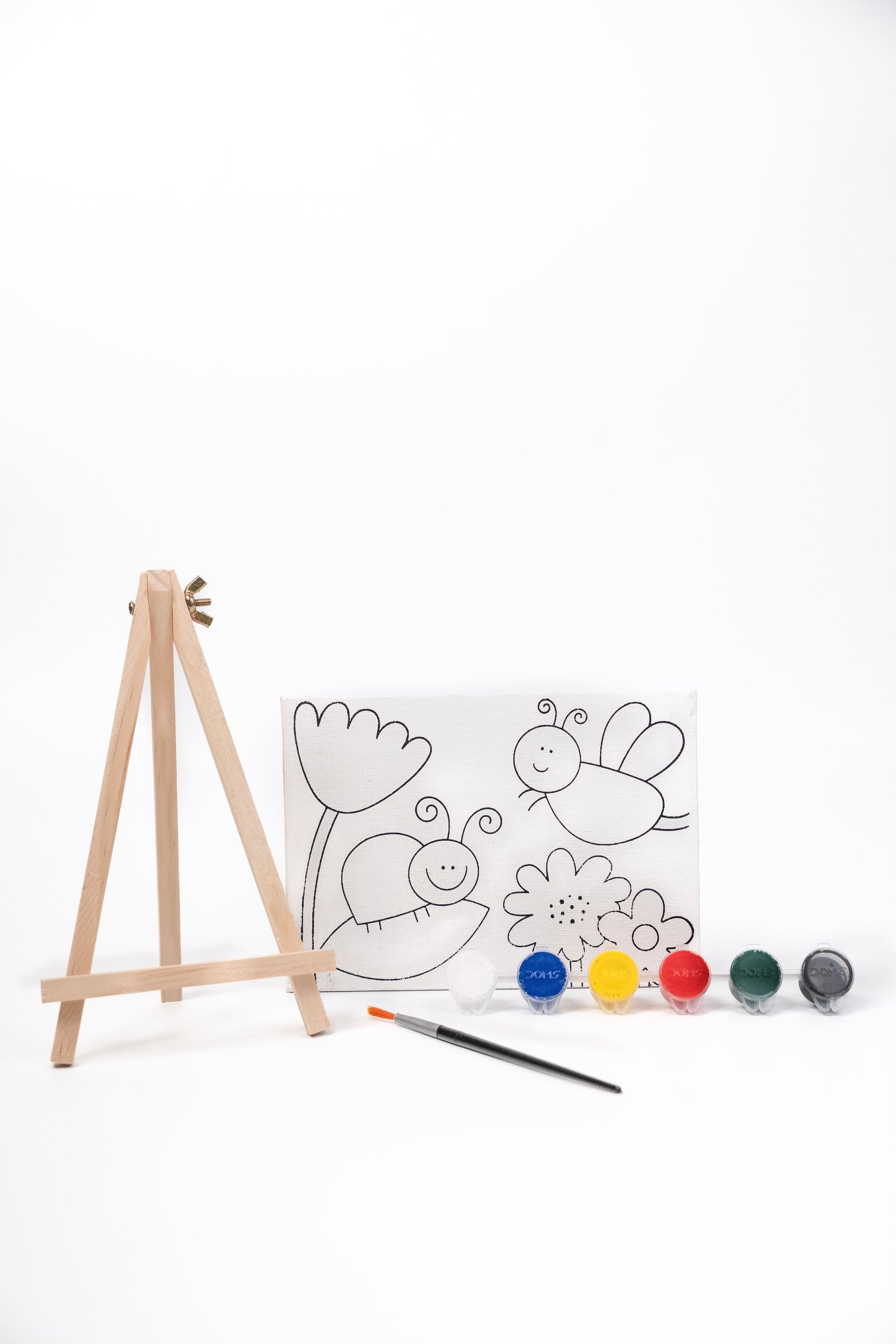 Contents of The Talking Canvas Garden Canvas Painting Kit including pre-printed garden canvas, wooden easel stand, paints and paint brush.