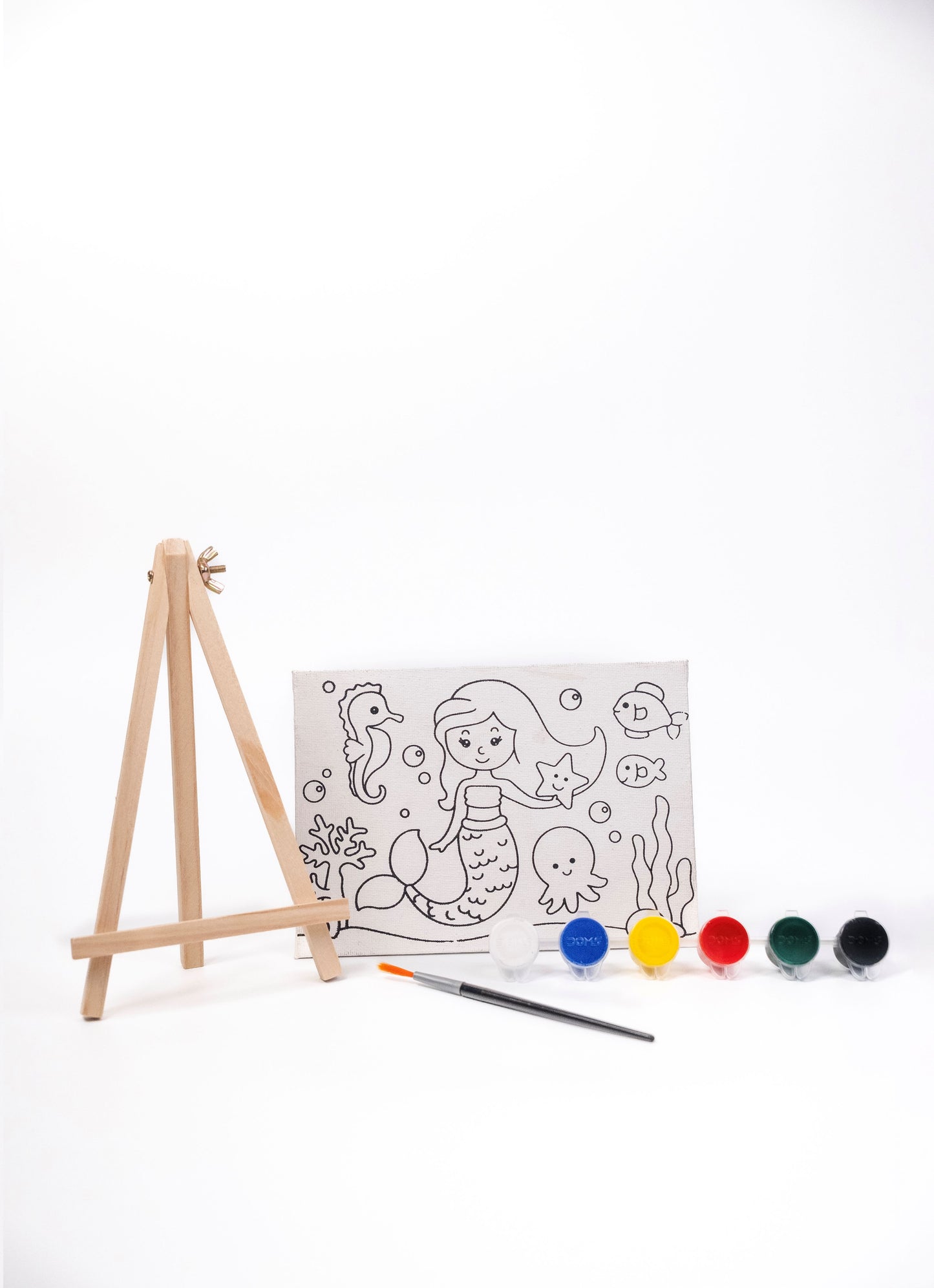 Contents of The Talking Canvas Mermaid Canvas Painting Kit including pre-printed canvas, wooden easel stand, paints and paint brush.