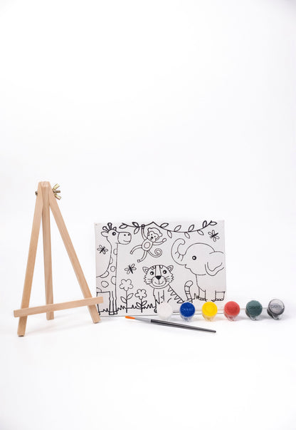 Contents of The Talking Canvas Jungle Canvas Painting Kit including pre-printed jungle canvas, wooden easel stand, paints and paint brush.