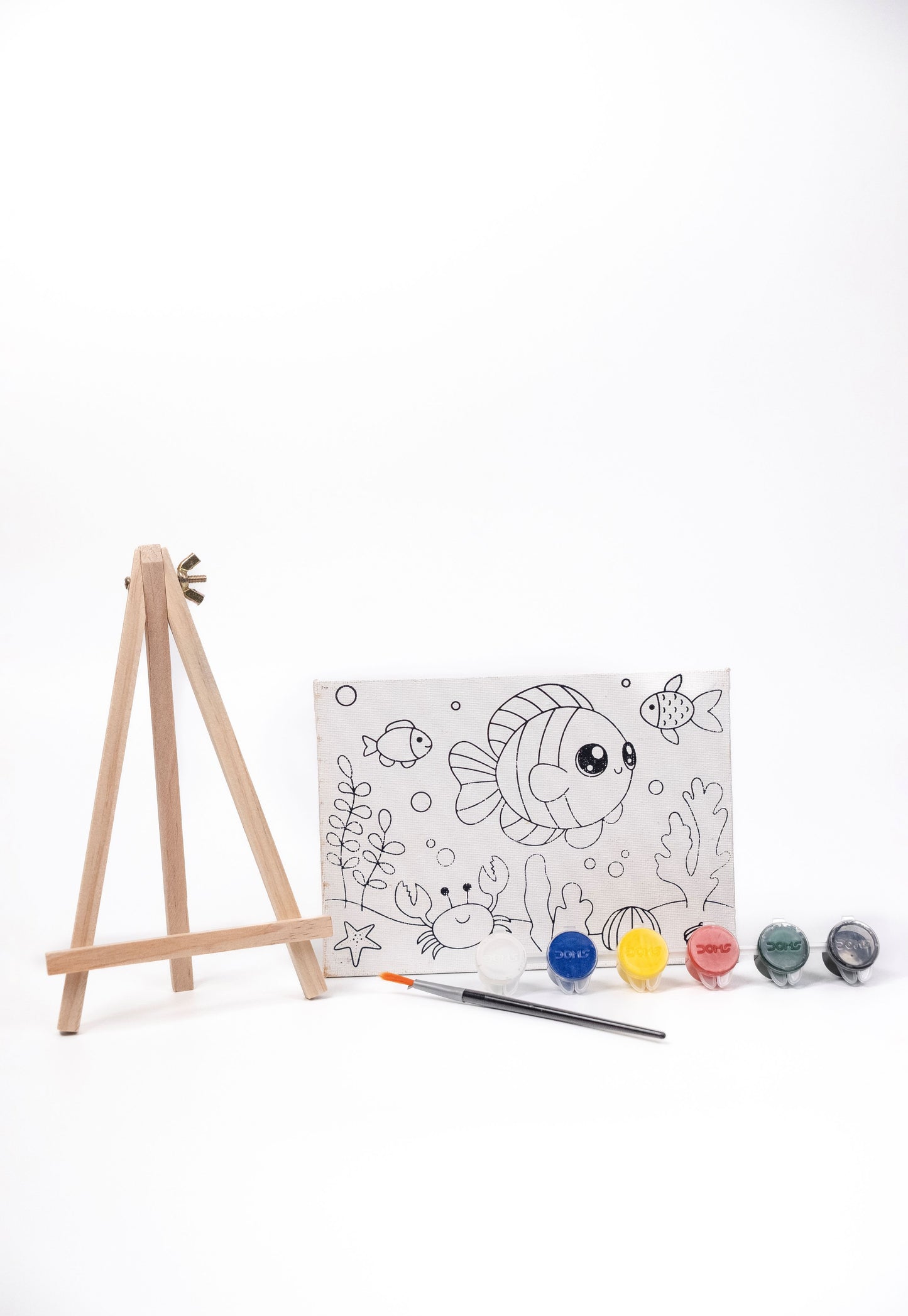 Ocean Canvas Painting Kit contents featuring a pre-printed underwater canvas, wooden easel, six acrylic paint pots and paint brush on a white background.
