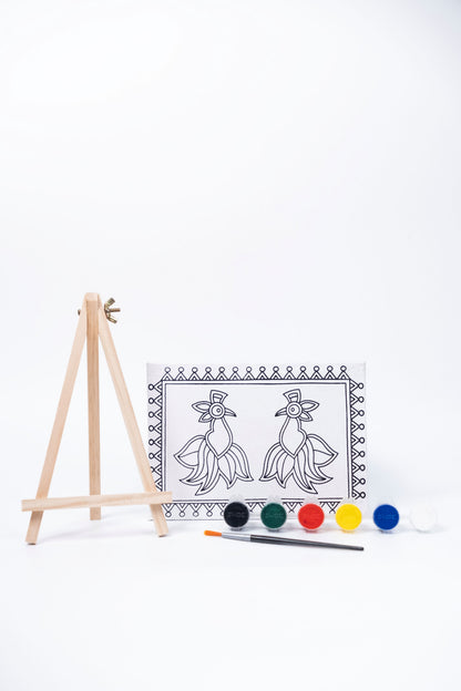 Contents of The Talking Canvas Madhubani Parrot Canvas Wall Art DIY Kit with outlined canvas, easel, brush and 6 acrylic paints.