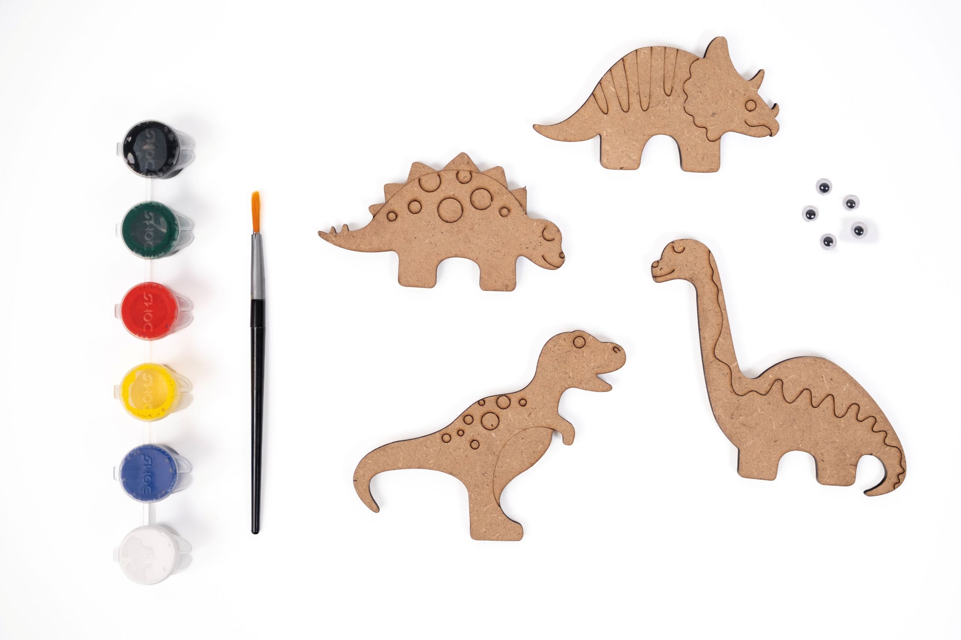 Dinosaur Magnets DIY Kit contents with four MDF dinosaur magnet shapes, six acrylic paint pots, paint brush and five googly eyes on a white background.