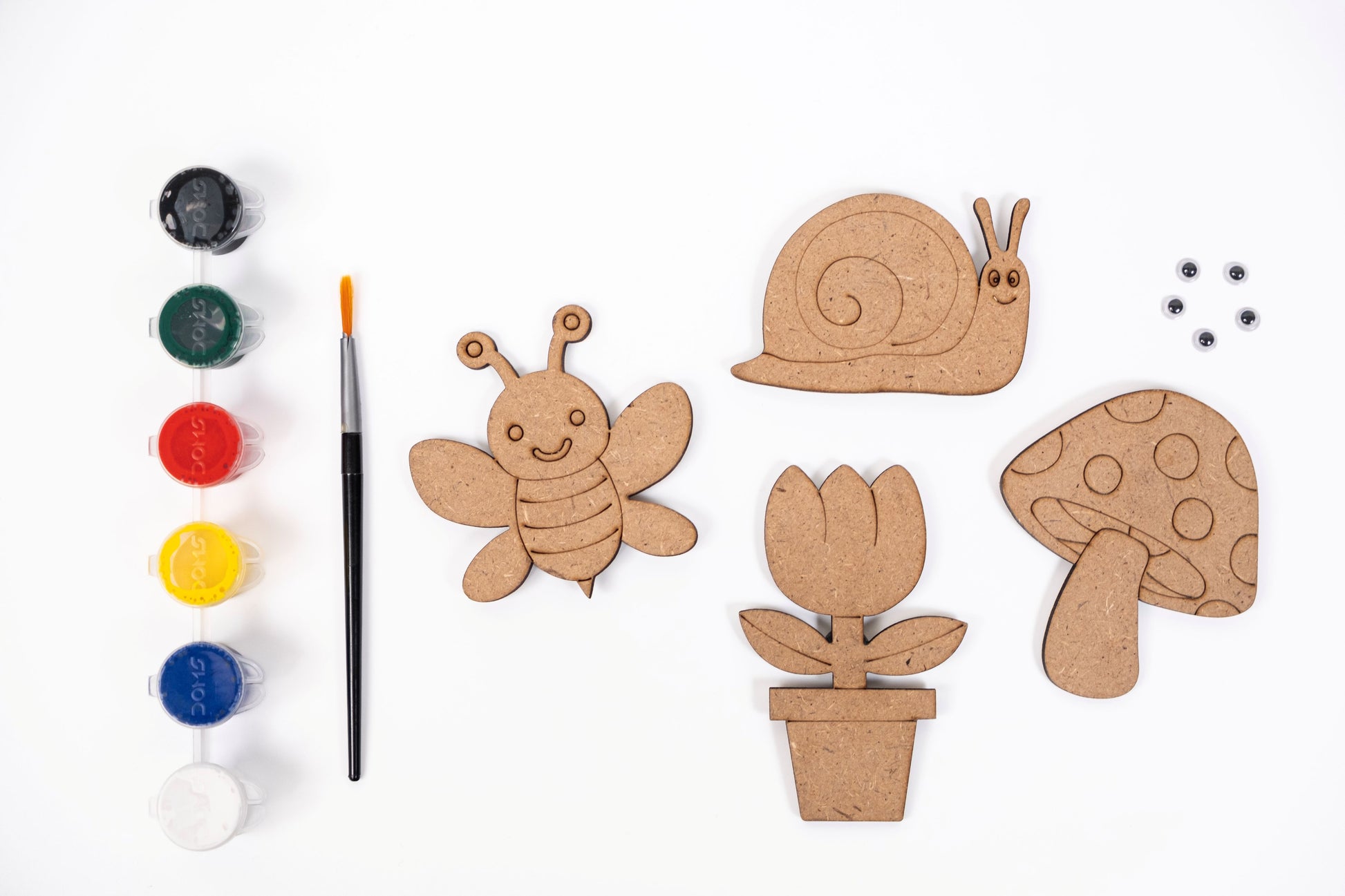 Garden Magnets DIY Kit contents with four MDF garden magnet shapes, six acrylic paint pots, paint brush and five googly eyes on a white background.