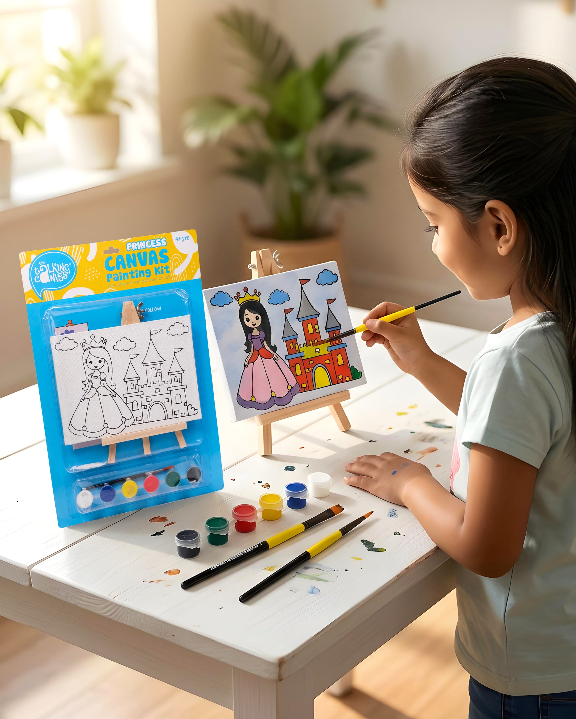 Child painting the Princess Canvas Painting Kit on a wooden easel using colourful acrylic paints during a fun screen-free creative activity.
